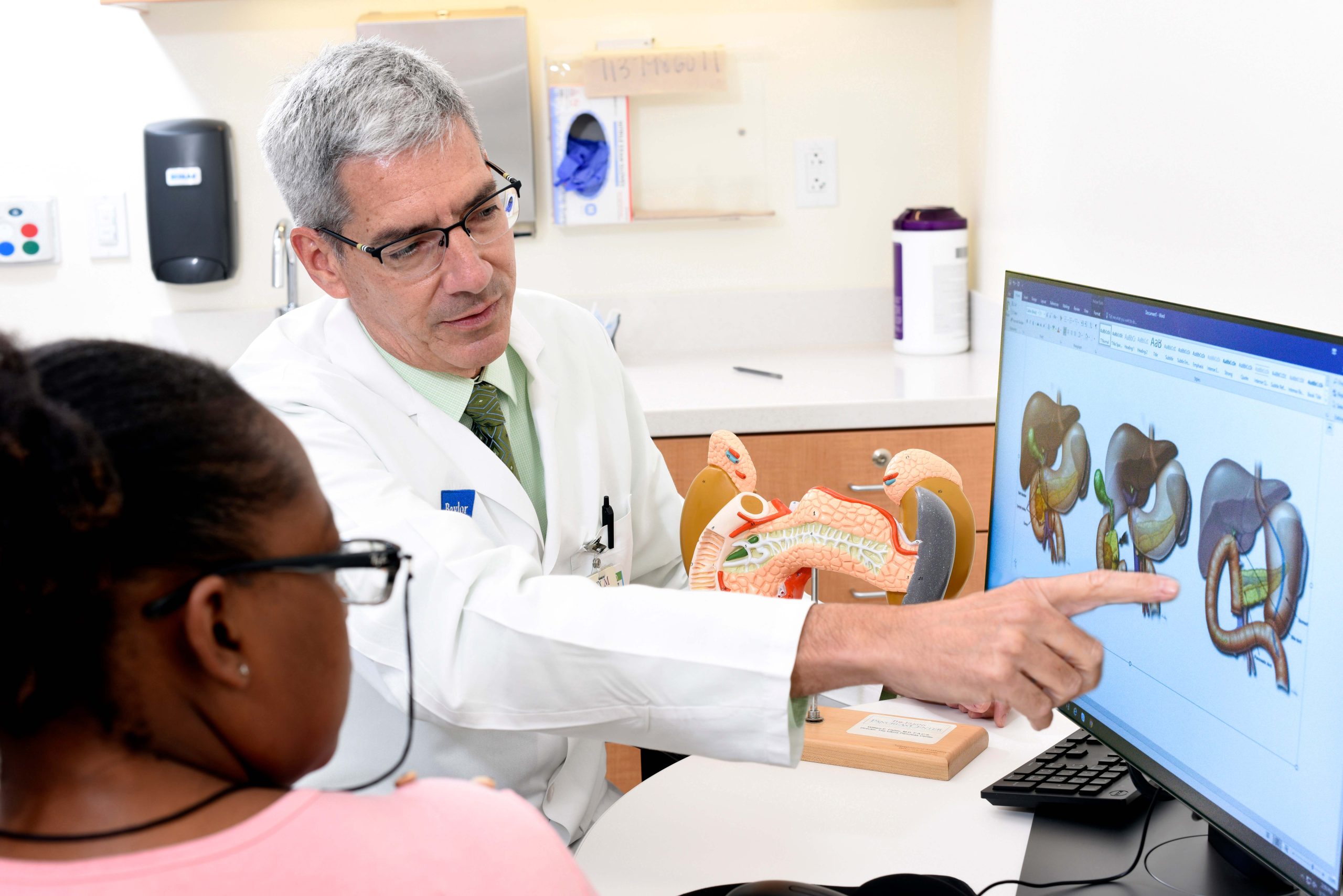 Dr. William Fisher with patient.