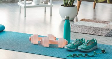 Sports equipment on yoga mat at home