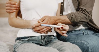 Couple holding a pregnancy test.