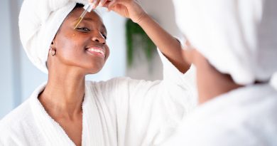 Woman applying skincare.