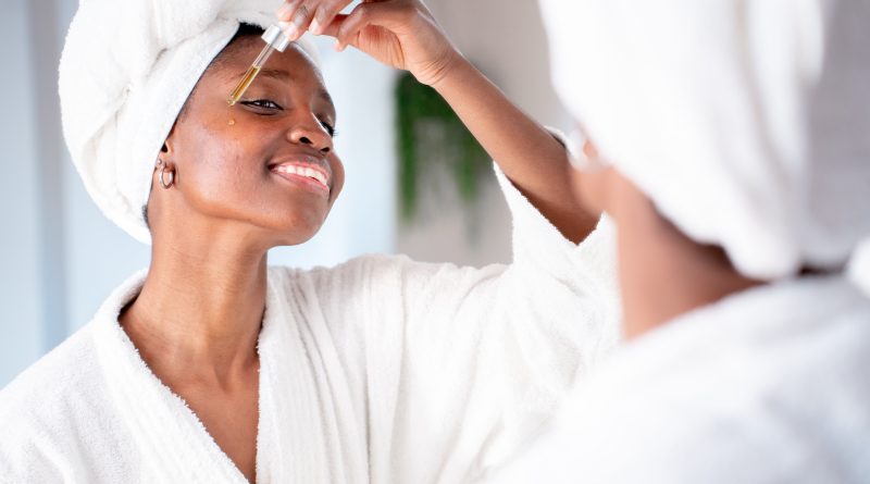 Woman applying skincare.