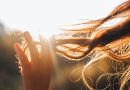 Woman touches the lock of hair. Selective focus