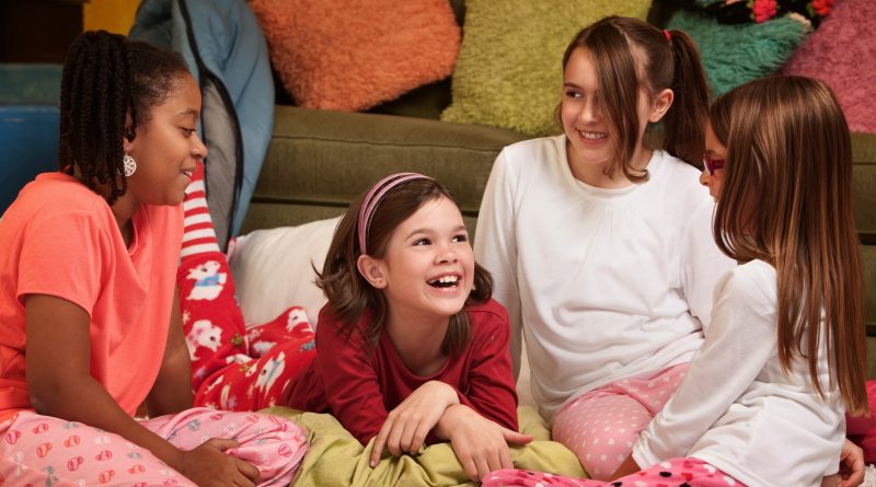 Group of happy young girls at a sleepover