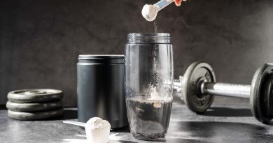 Creatine powder in a measuring scoop.