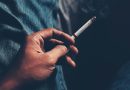 Hand holding a cigarette.