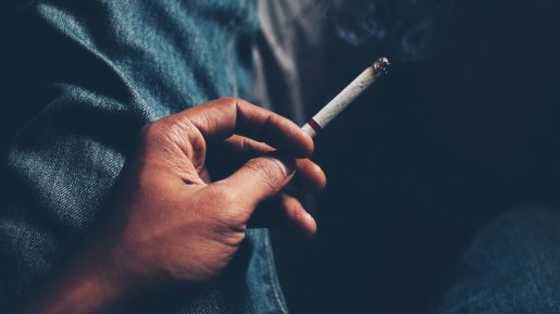 Hand holding a cigarette.
