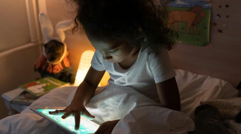Child using tablet.