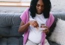 Pregnant woman taking prenatal vitamins.