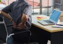 Sitting at desk with back pain.