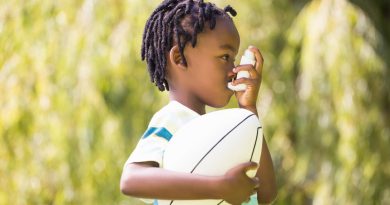 Child with inhaler.