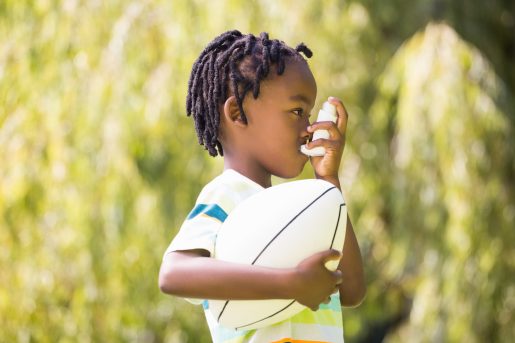 Child with inhaler.
