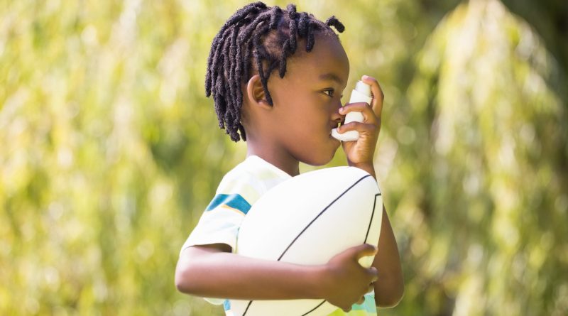 Child with inhaler.