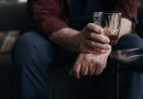Hand holding a drink.