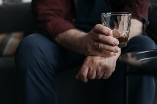 Hand holding a drink.