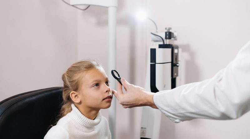 Child getting eye exam.