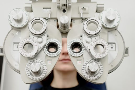 Person undergoing eye exam.