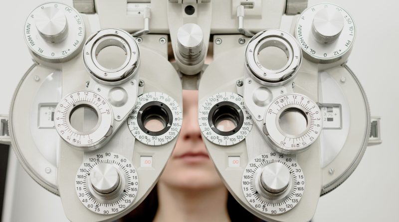 Person undergoing eye exam.
