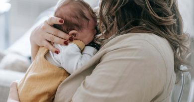 Woman holding baby.